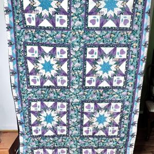 Photo of Throw Sized Hand Made Patchwork Quilt That Folds into a Pillow