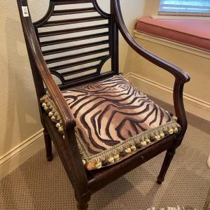 Photo of Beautiful arm chair with animal print pillow