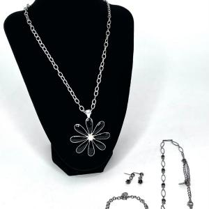 Photo of Black Daisy Pendant Necklace, Bracelet, and Earrings Set