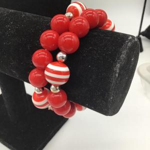 Photo of Red and red and white stripe beaded bracelets