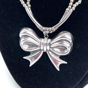 Photo of Sterling Silver Bow Pendant with Necklace and Earrings