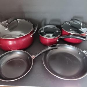 Photo of Unbranded red pots & pans with three universal lids- lightly used