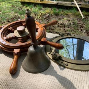 Photo of LOT 77: Nautical Decor with Wooden Ship's Wheel Brass Porthole Mirror and Brass 