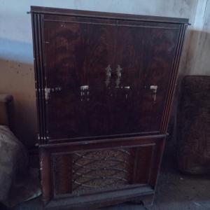 Photo of Vintage Television in Wooden Cabinet