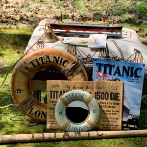 Photo of LOT:73: Titantic Memorabillia Including an Oar, Life Preserver, Model Ship, Blan