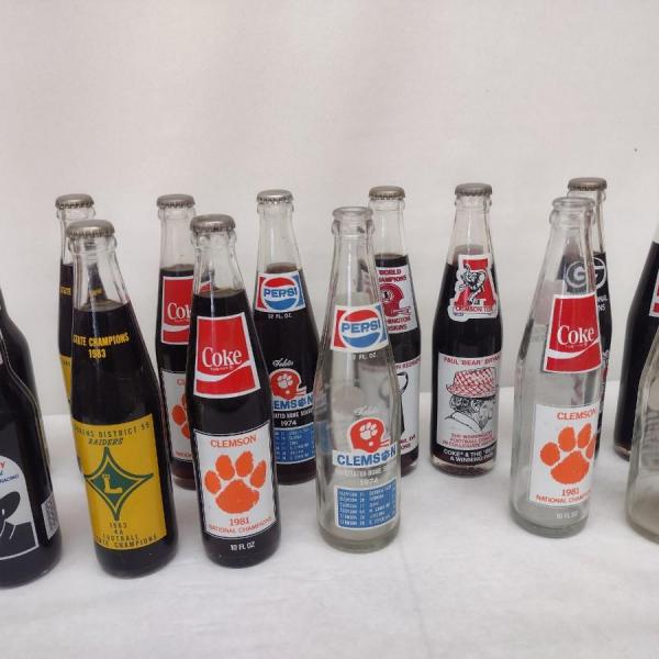 Photo of Nice Assortment of Collectible Pepsi and Coca-Cola Sports Themed Bottles Clemson