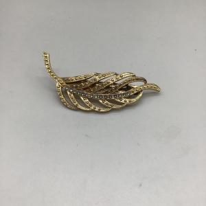 Photo of Gold toned leaf hair accessories