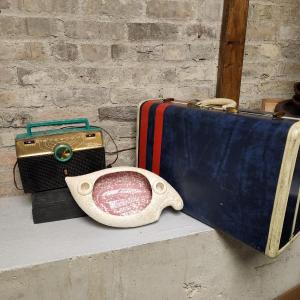 Photo of Kitchy awesome radio, suitcase and console