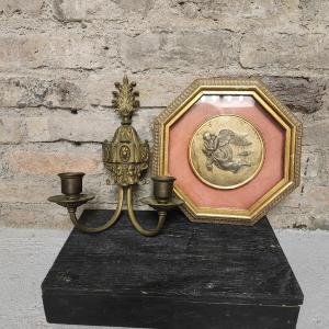 Photo of Brass sconce and brass medallion