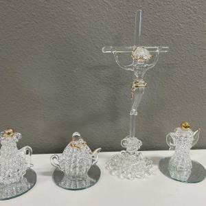 Photo of Hand blown spoon, glass, crucifix, and teapot