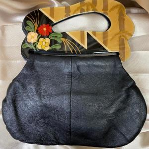 Photo of Leather and plastic hand bag