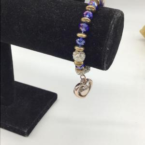 Photo of Blue and gold toned beaded bracelet