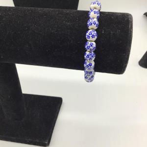Photo of White beads with blue flowers bracelet