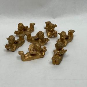 Photo of 7 pc lot of golden angels laying on their tummies reading