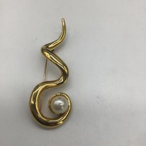 Photo of Swirl design gold toned pin