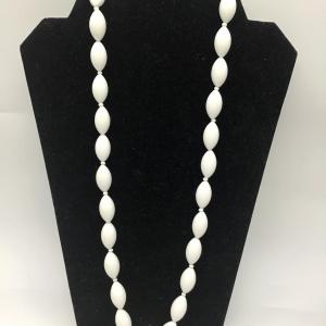 Photo of Vintage white necklace with bottlecap like pendant