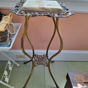Photo of Wrought iron table with marble insert