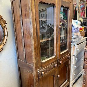 Photo of Antique wooden display cabinet with latching doors