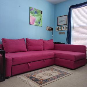 Photo of LOT 31: Ikea Friheten Raspberry Pink Sofa Bed