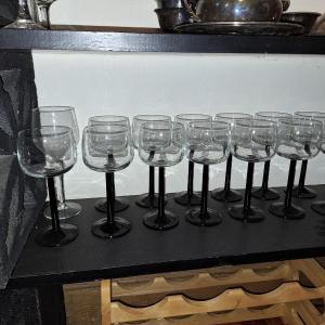 Photo of 13 black stem wine glasses