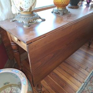 Photo of drop leaf table on casters