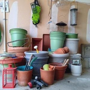 Photo of LOT 253: Large Collection of Flower Pots w/ Gardening Tools, Bird Feeders & More