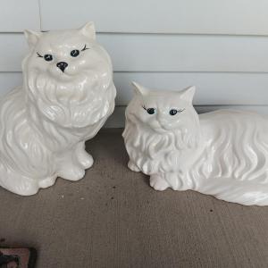 Photo of Two big porcelain cat statues