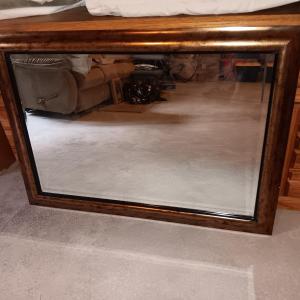 Photo of Wood Framed wall mirror with beveled glass.