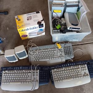 Photo of Assortment of computer keyboards and drives and other Computer accessories