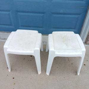 Photo of Two white plastic patio end tables