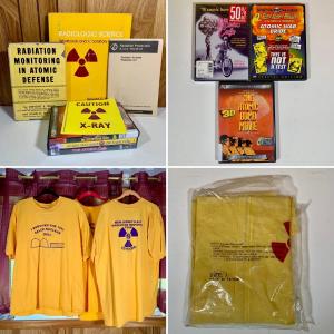Photo of LOT 77: Atom Bomb Baby Collection: Movies, Books, Shirts, Radiation Suit, & Stic