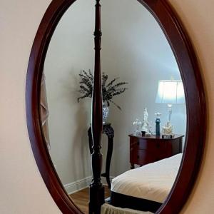 Photo of Mahogany framed oval mirror