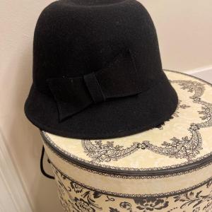Photo of Black wool cloche hat with bow