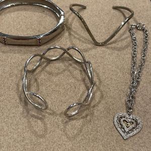 Photo of 4 silver tone bracelets