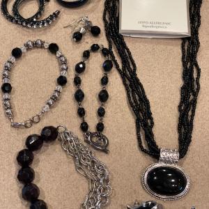 Photo of Black and silver tone jewelry