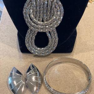 Photo of Large silver tone necklace, earrings and bracelet