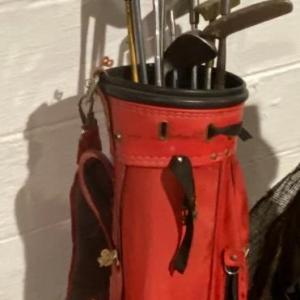 Photo of Bag of Golf Clubs and Golfing Essentials