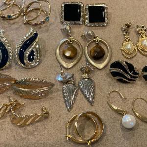 Photo of 11 pairs of vintage gold tone earrings