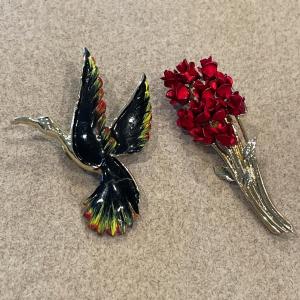 Photo of Gerry’s bird of paradise brooch and flower brooch