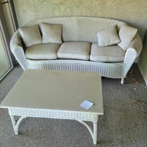 Photo of White wicker sofa and coffee table set