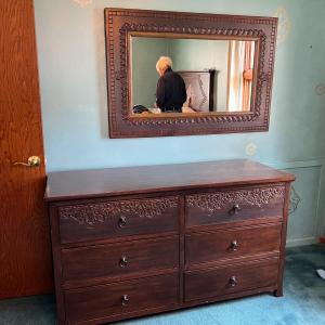 Photo of bedroom chest of drawers with mirror
