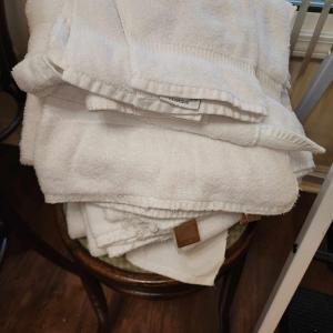 Photo of Lot of white bath towels