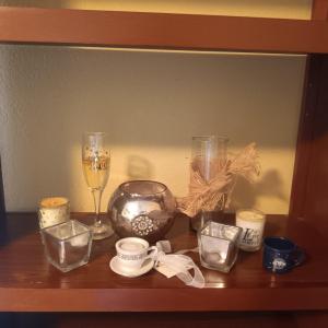 Photo of AN ASSORTMENT OF CANDLES AND HOLDERS