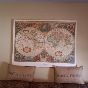 Photo of REPRODUCTION ANTIQUE MAP OF THE WORLD AND 2 BURLAP THROW PILLOWS