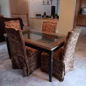 Photo of CLASSY WICKER BORDERED, GLASS TOP DINING TABLE WITH 4 SLIP COVERED CHAIRS