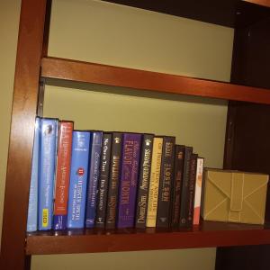 Photo of AN ASSORTMENT OF BOOKS AND A BATH & BODY WORKS GREETING CARD HOLDER