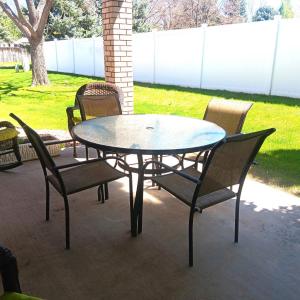 Photo of GLASS TOP PATIO TABLE W/4 CHAIRS