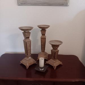 Photo of 3 MATCHING CANDLE HOLDERS AND A SMALL CANDLE IN GLASS
