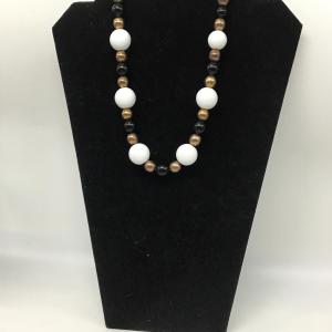 Photo of Gold toned, white, and black beaded necklace