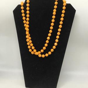 Photo of Orange extra long beaded necklace